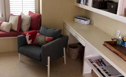 straightening and tucking the guest room